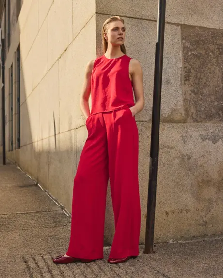 Blouse sans manches courtes avec boutons sur les côtés