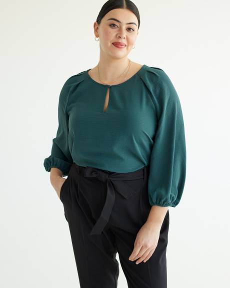 Blouse à manches longues et encolure dégagée