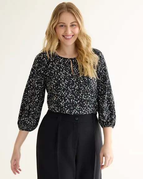 Blouse à manches longues et encolure dégagée