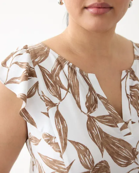 Blouse sans manches à encolure fendue et épaules à volants